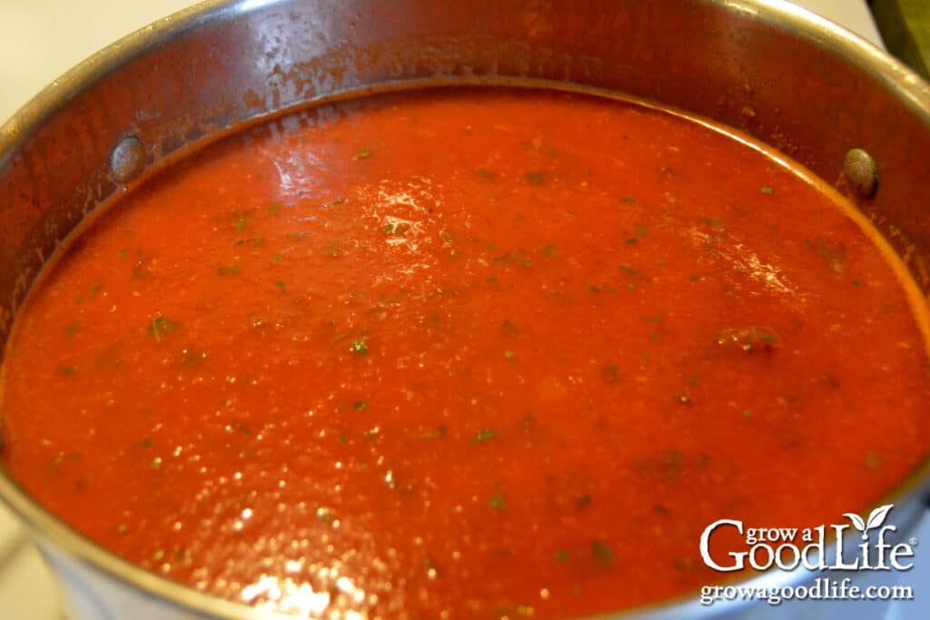 A pot of oven-roasted tomato sauce ready to go in jars for canning.