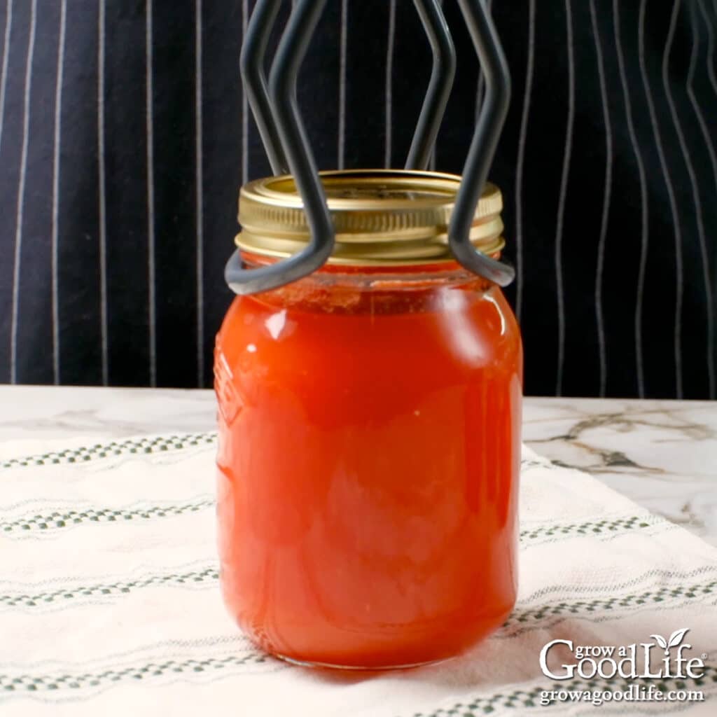 Placing a hot jar on a towel to cool.